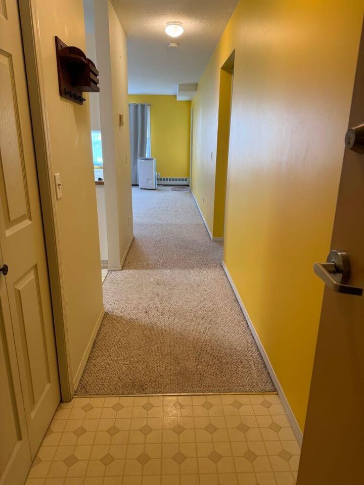 Property Photo:  105 7 Avenue SE 204  AB T1V 1T8 