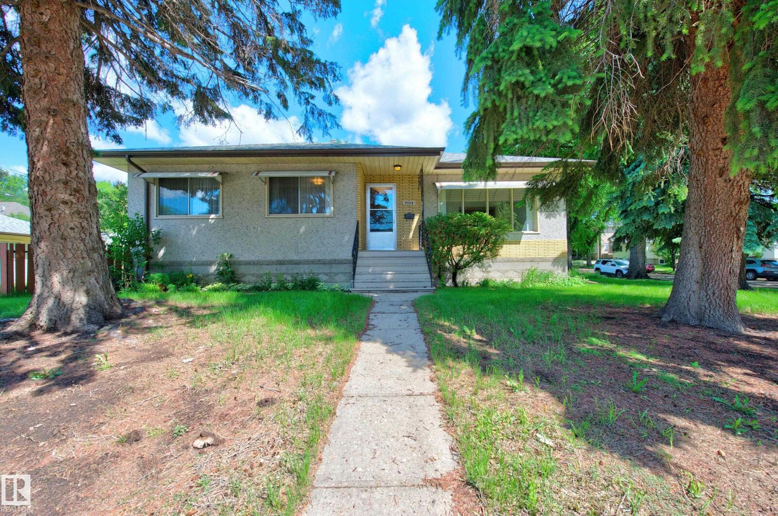 Property Photo:  7704 104 Avenue NW  AB T6A 0Y3 