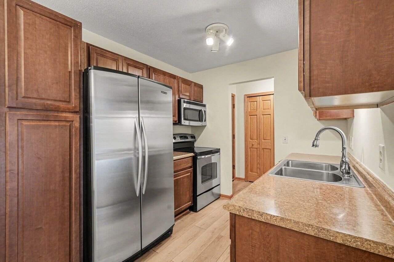 Property Photo:  205 Barry Avenue S 207  MN 55391 