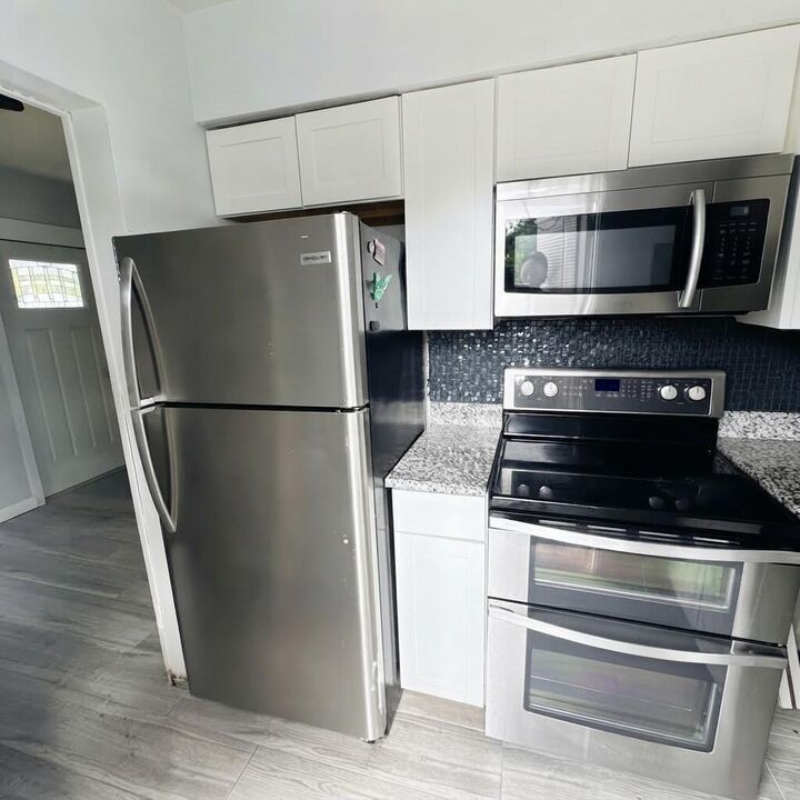 Property Photo:  1500 NE 62nd Street 1  FL 33334 