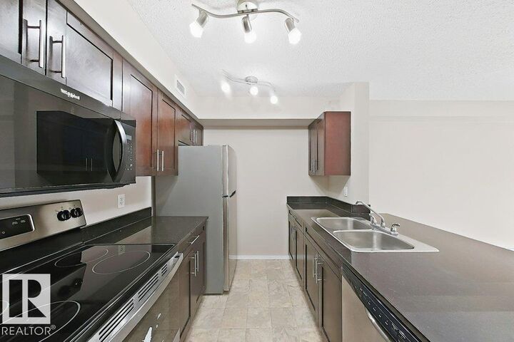 Property Photo:  12025 22 Ave SW 203  AB T6W 2Y1 