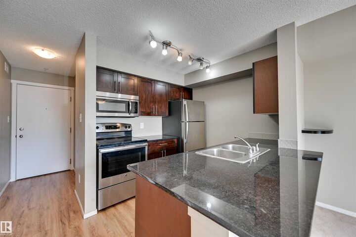 Property Photo:  18126 77 Street NW 319  AB T5Z 0N7 