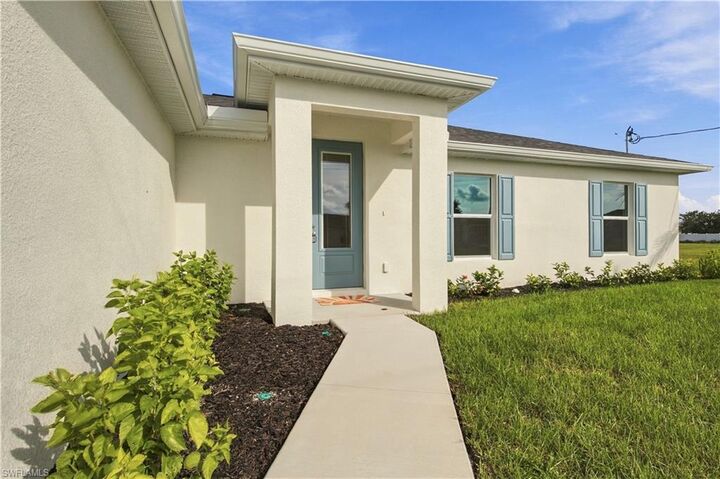 Property Photo: 1135 NW 8th Pl FL 33993