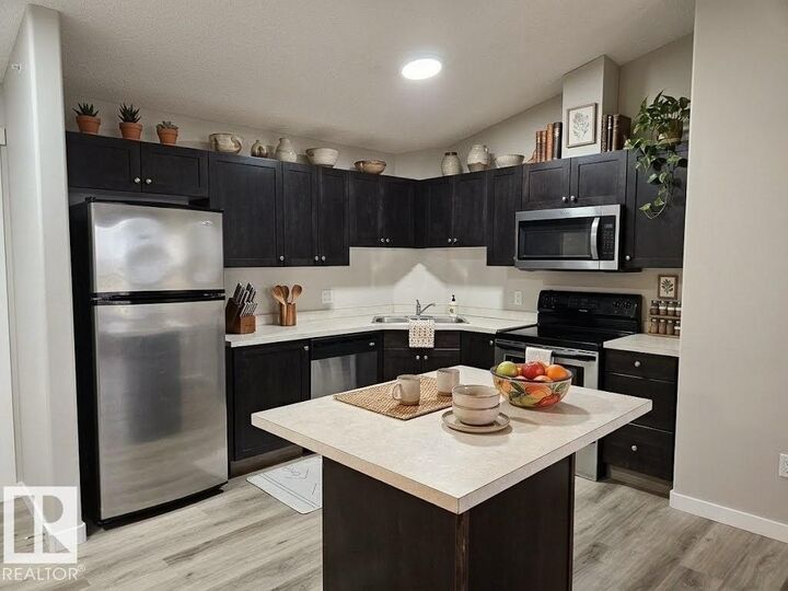 Property Photo: 9363 Simpson Drive NW 1411 AB T6R 0N2