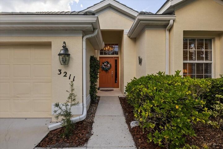 Property Photo:  3211 Woodland Fern Drive  FL 34219 