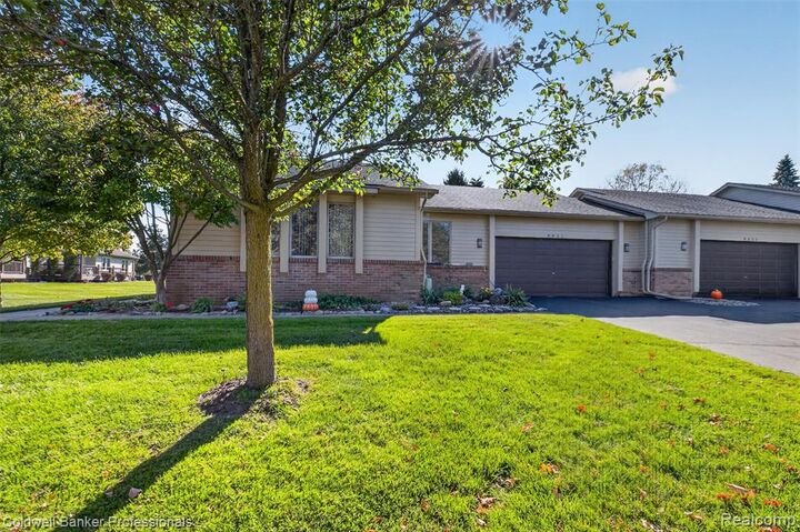 Property Photo: 8421 Solca Drive 33 MI 48386