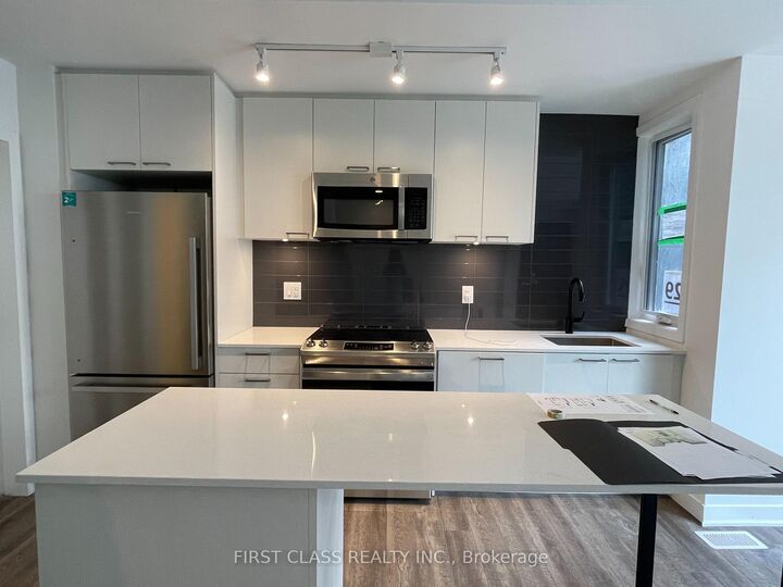Property Photo:  20 Ed Clark Gardens Th13  ON M6N 1J5 