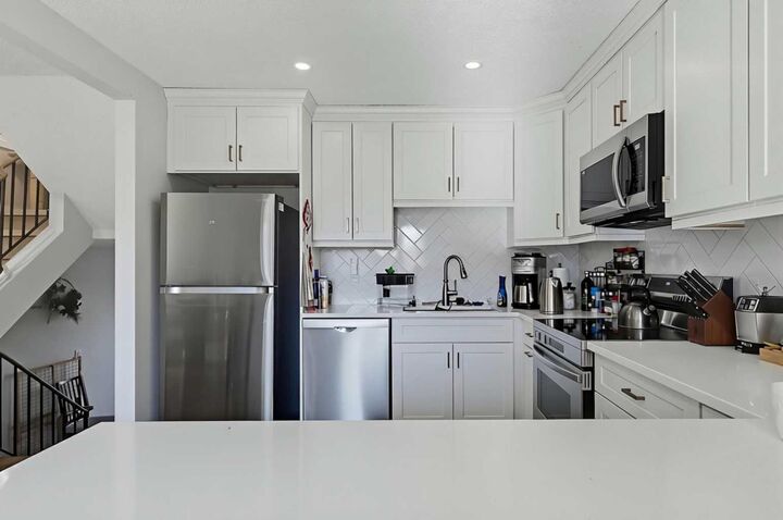 Property Photo: 302 Woodvale Crescent SW AB T2W 3P3