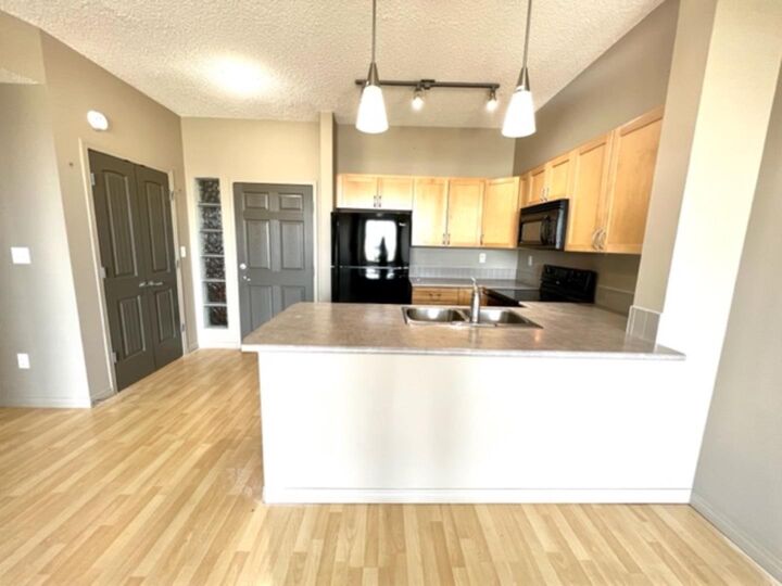 Property Photo: 12330 102 St 215 AB T8V 0N4