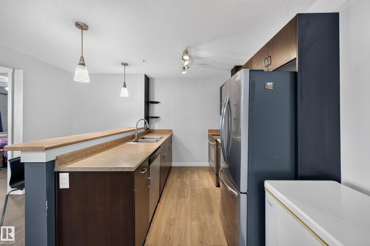 Property Photo:  1180 Hyndman Road NW 326  AB T5A 0P8 