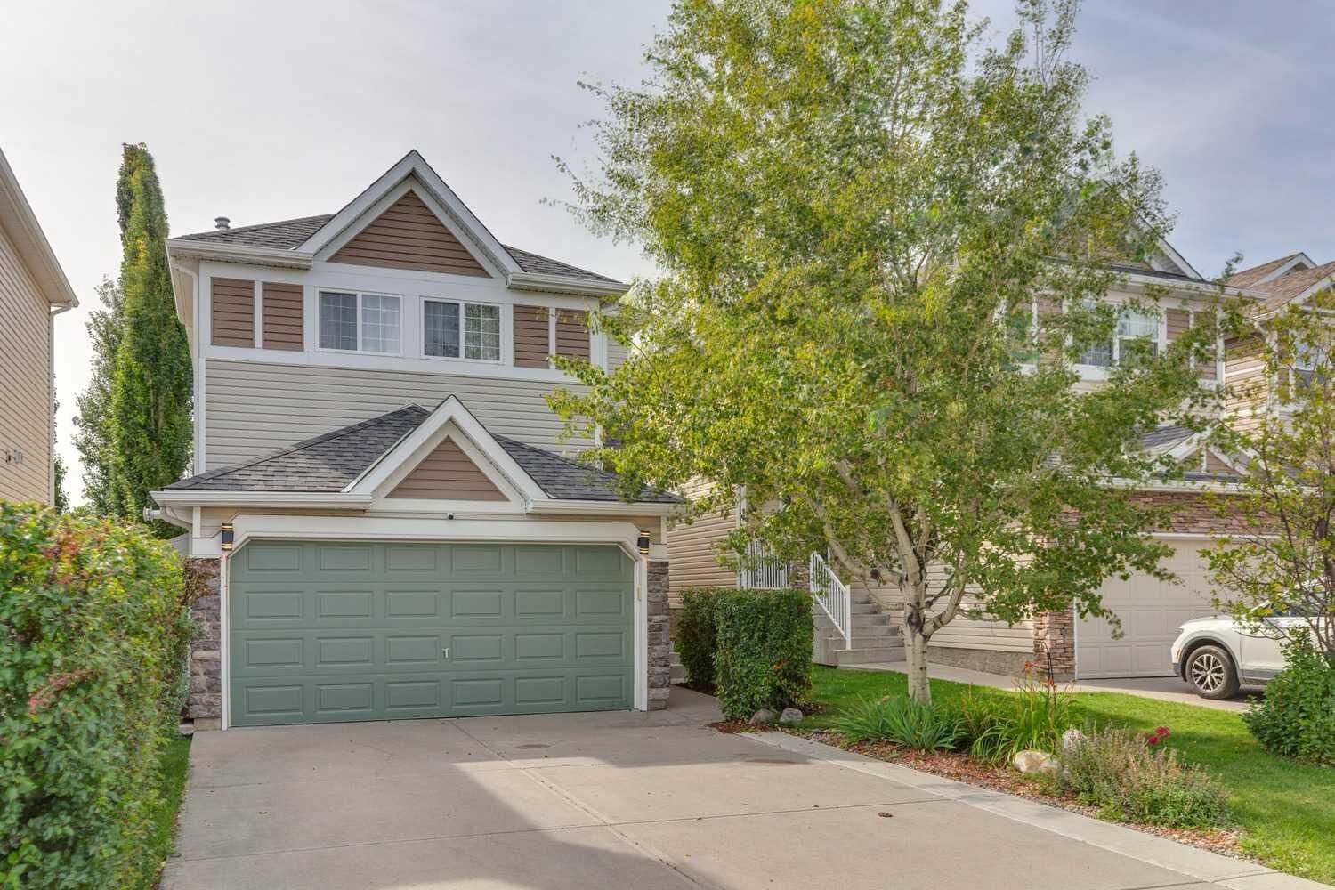 Property Photo:  242 Cougar Plateau Mews SW  AB T3A 4W5 