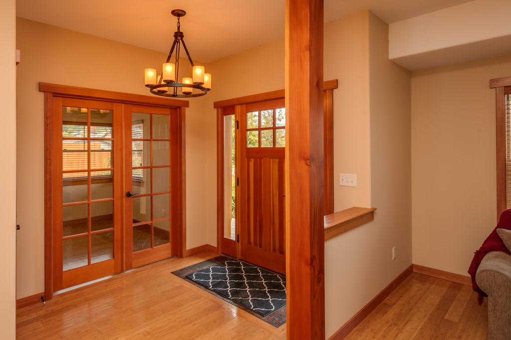 Property Photo: The front entry is so inviting with the bamboo flooring with tile at the entry, fir doors and trim and french doors that lead to the den. 2415 Fir St  WA 98229 